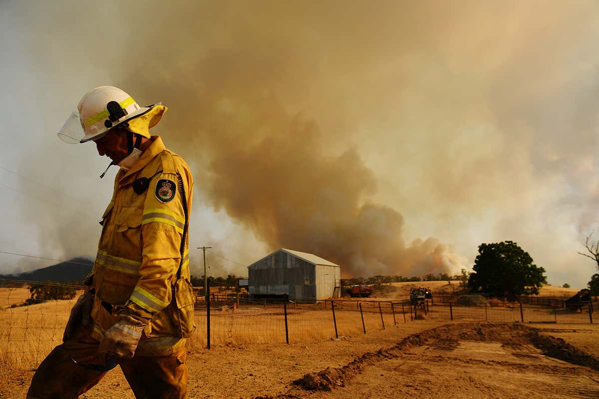 A bushfire burns out of control near Tumburumba