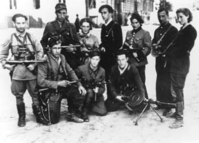 Abba Kovner (standing center) and other Vilna ghetto fighters July–August 1944