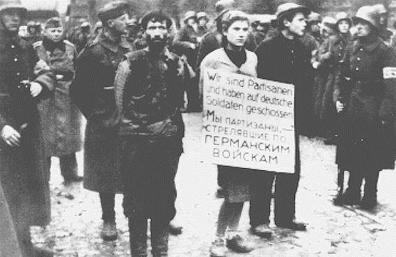 Minsk October 26, 1941. Three resisters paraded through the streets before their execution 